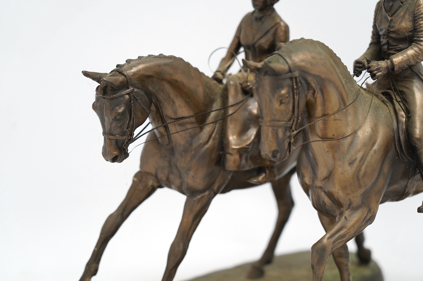 Harriet Glen and David Crenty, two cold cast resin bronze equestrian groups, 32cm wide. Condition - good